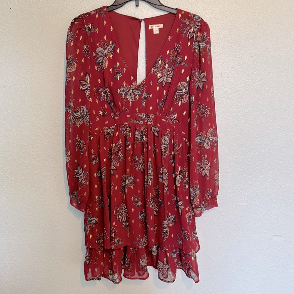 Francesca’s midi maroon dress with sheer sleeves.